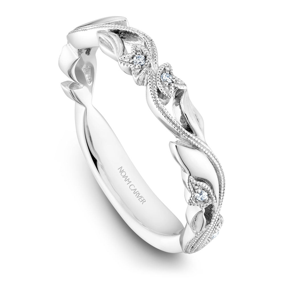 Intricate white gold band with diamonds.