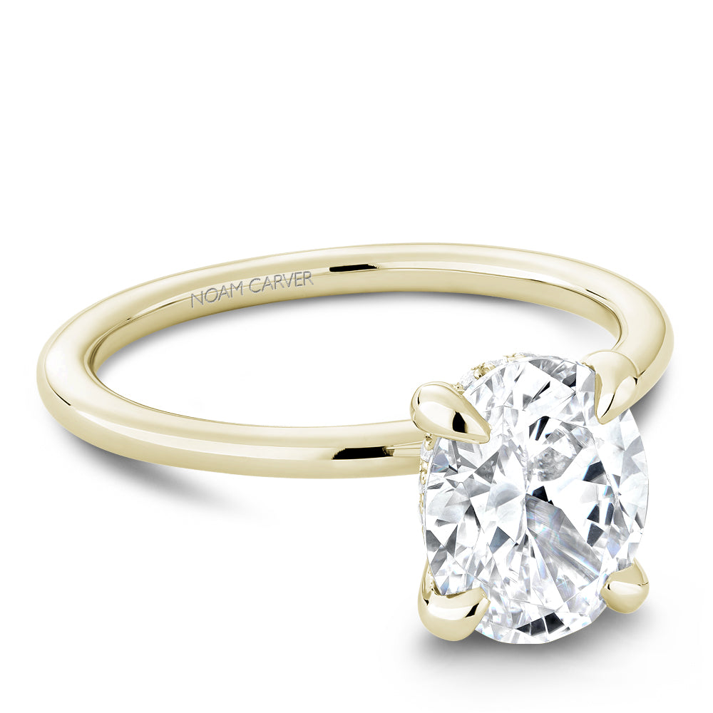 Yellow gold solitaire diamond engagement ring.