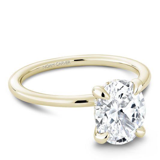 Yellow gold solitaire diamond engagement ring.