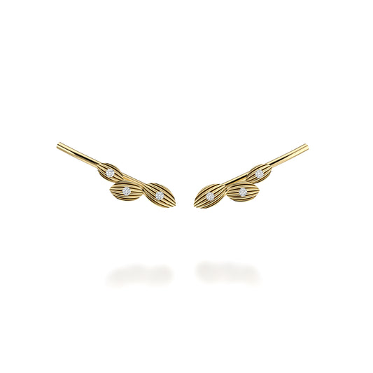 Yellow gold crawler earrings with round diamonds.