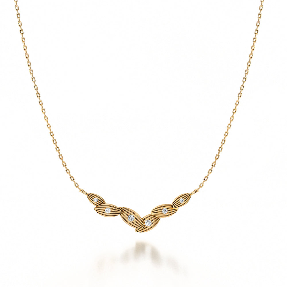 Yellow gold necklace with diamond accents.