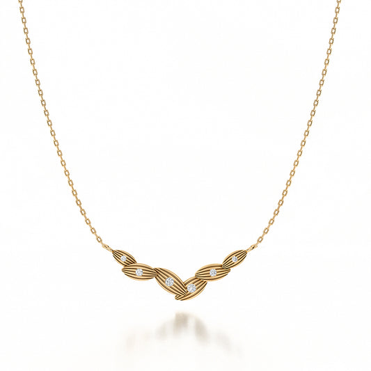 Yellow gold necklace with diamond accents.