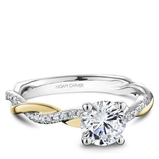 Two-tone diamond engagement ring with side stones.