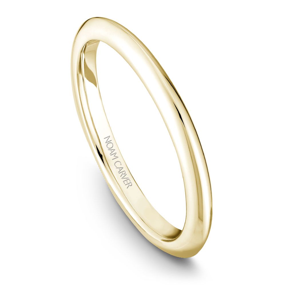 Polished yellow gold carved band ring.