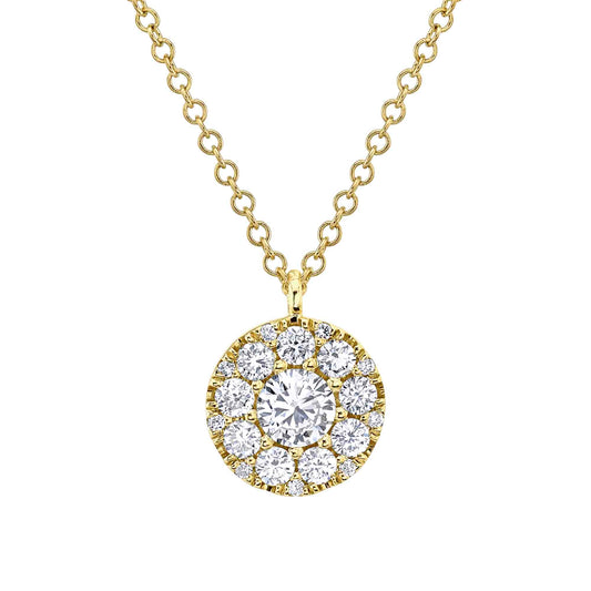 Yellow gold necklace with circular diamond pendant.