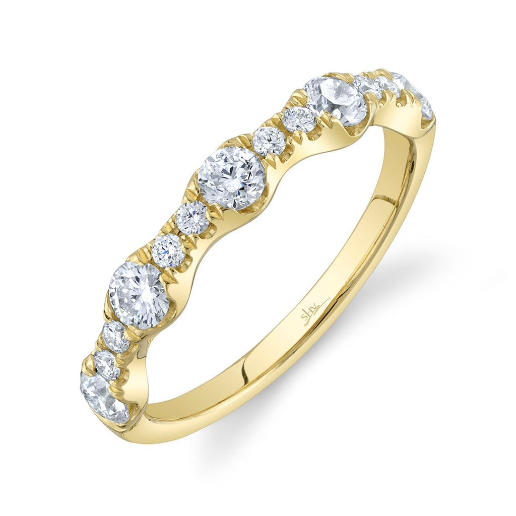 Yellow gold band with round diamonds.