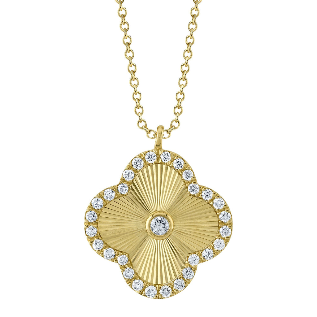 Clover-shaped yellow gold diamond necklace.