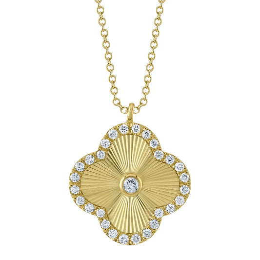 Clover-shaped yellow gold diamond necklace.