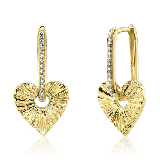 Gold heart-shaped dangle earrings with diamonds.