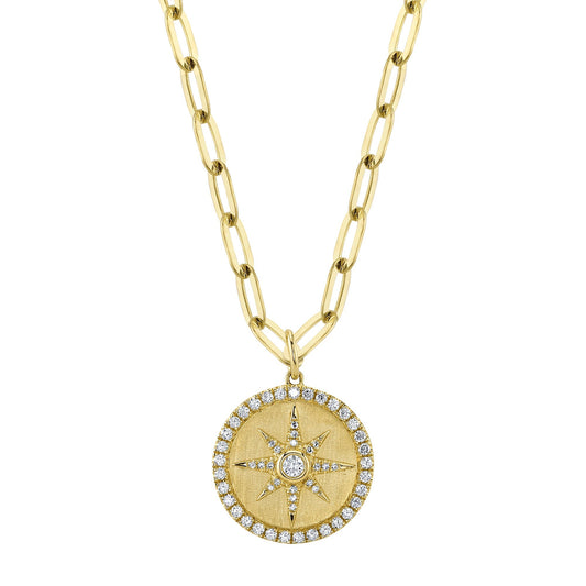 Yellow gold necklace with diamond star pendant.
