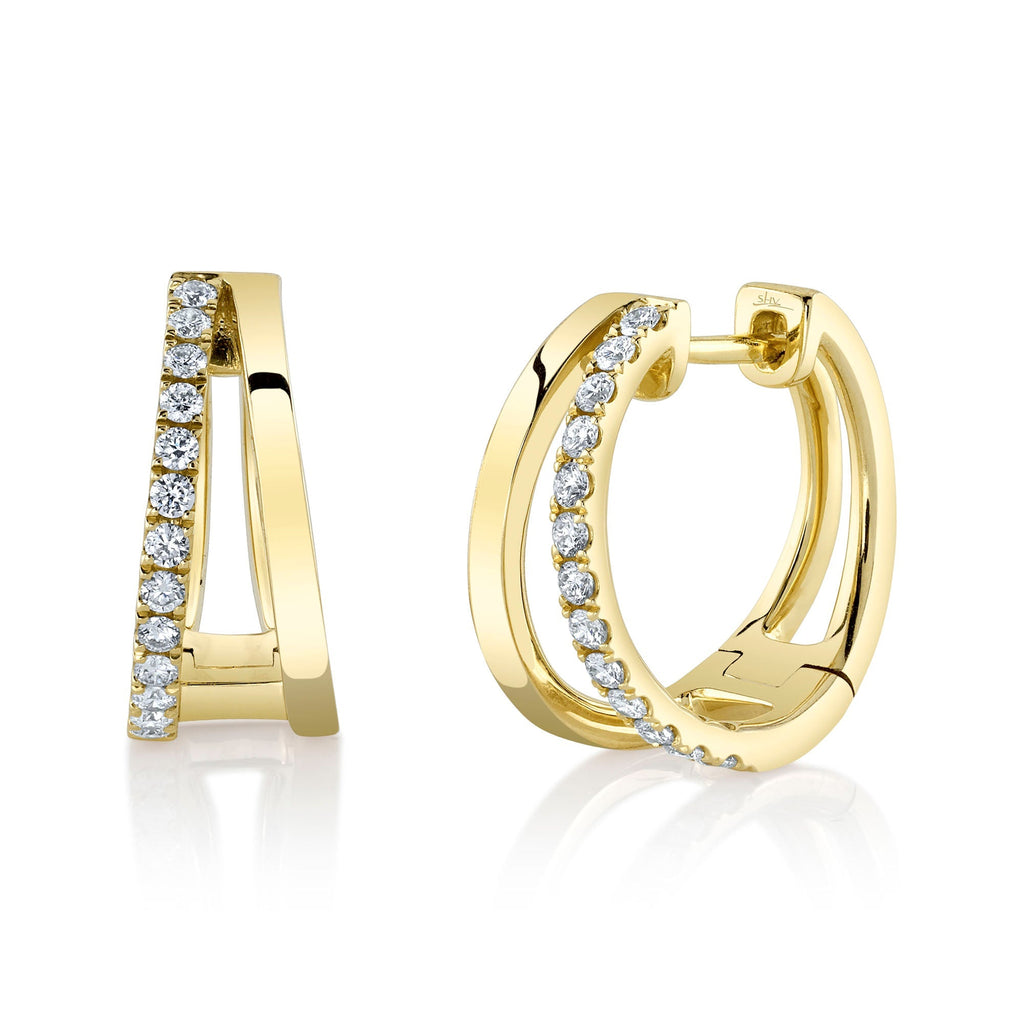 Yellow gold hoop earrings with round diamonds.
