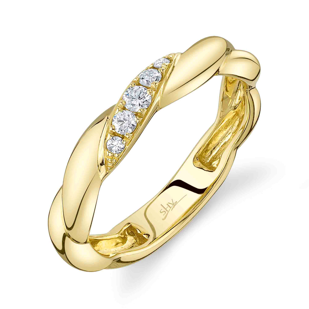 Twisted yellow gold band with diamonds.