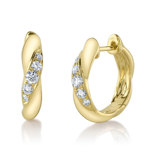 Huggie earrings with round diamonds.