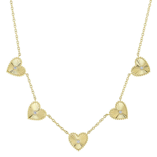Heart-shaped yellow gold diamond necklace.