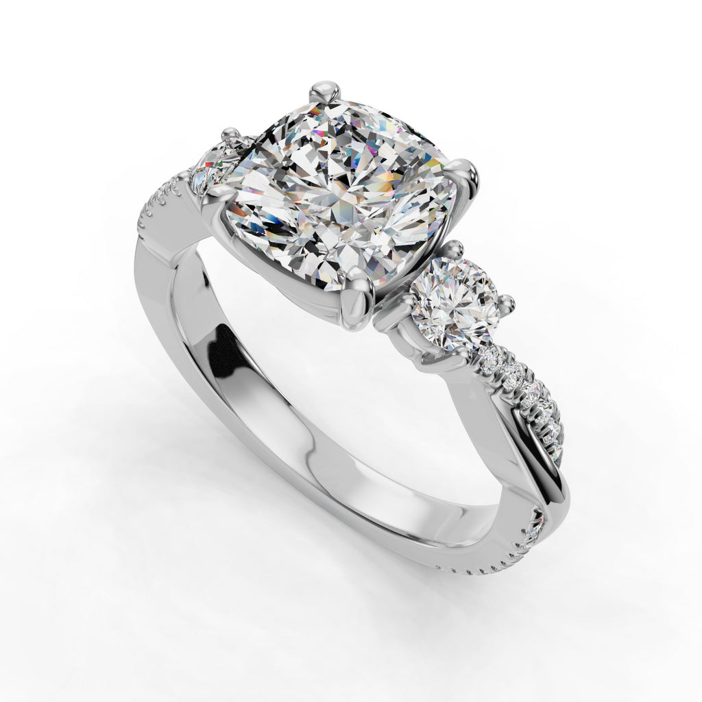 Cushion-cut diamond ring with side stones.