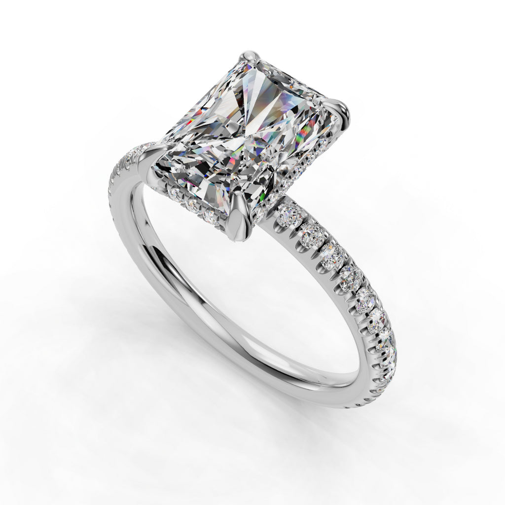 Radiant-cut diamond ring with pavé band.