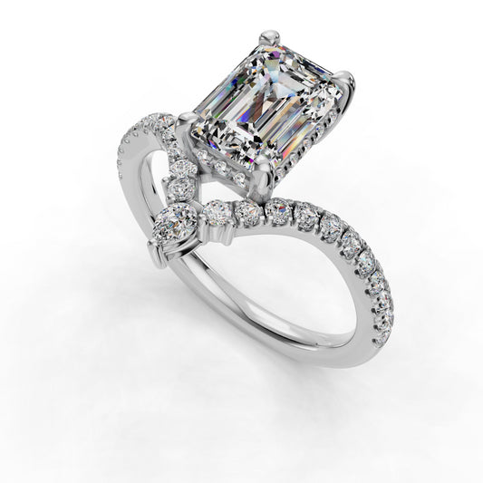 Emerald-cut diamond ring with pavé band.