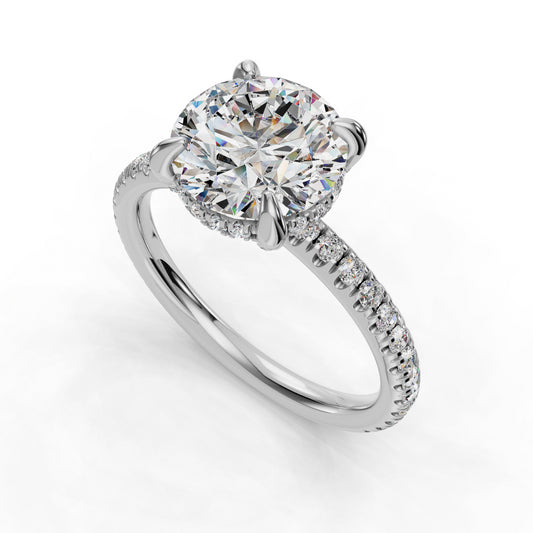 Round diamond ring with pavé band detailing.