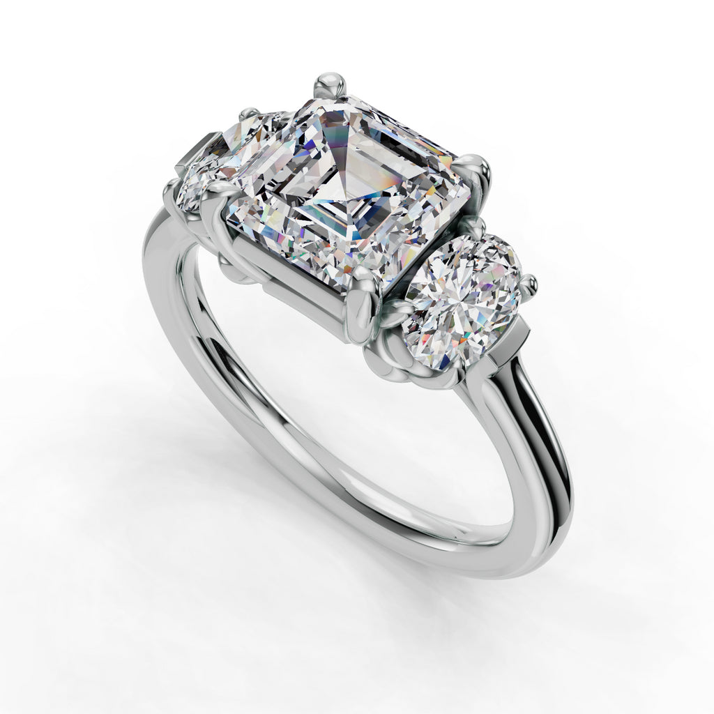 Three-stone diamond ring with emerald-cut center.