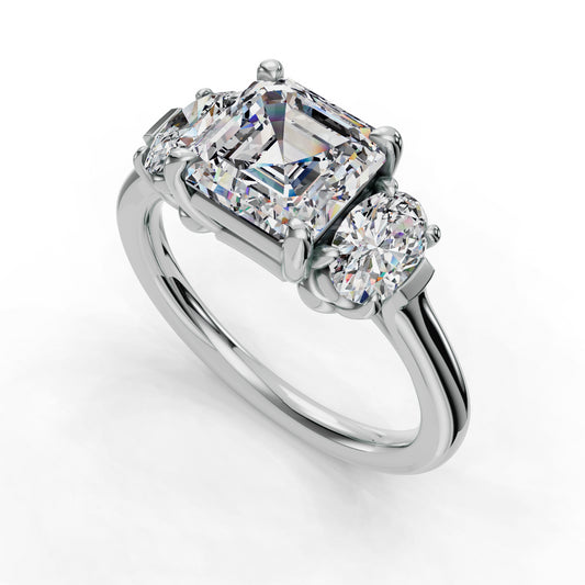 Three-stone diamond ring with emerald-cut center.