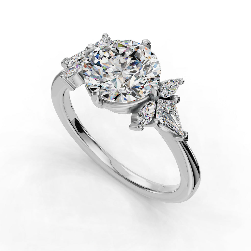 Round diamond ring with marquise accents.