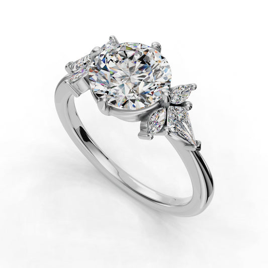 Round diamond ring with marquise accents.