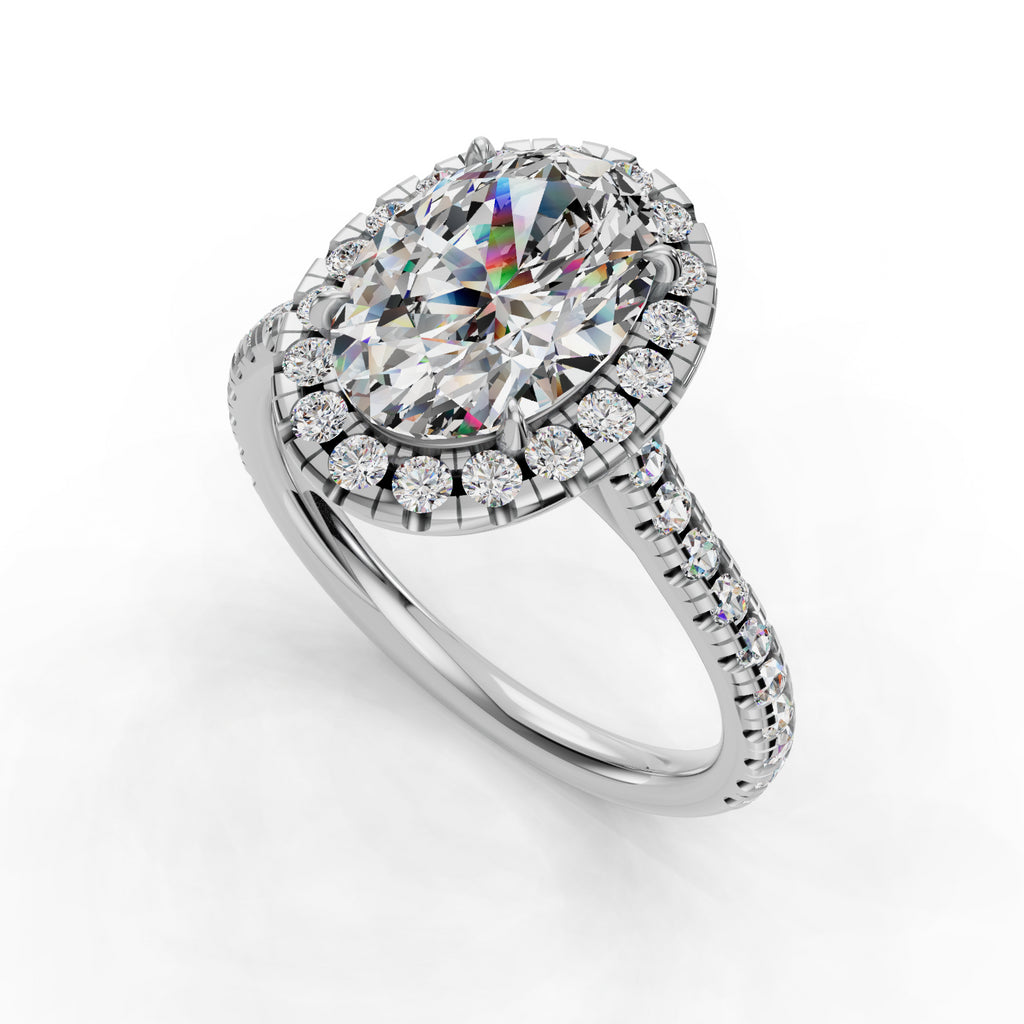 Oval diamond ring with halo and pavé band.
