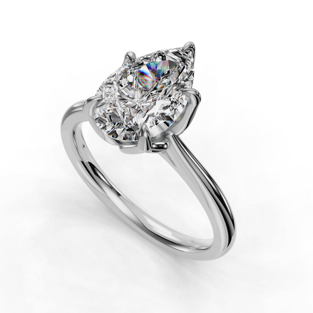 Pear-shaped diamond solitaire on sleek band.