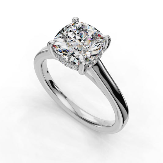 Cushion-cut diamond solitaire on platinum band.