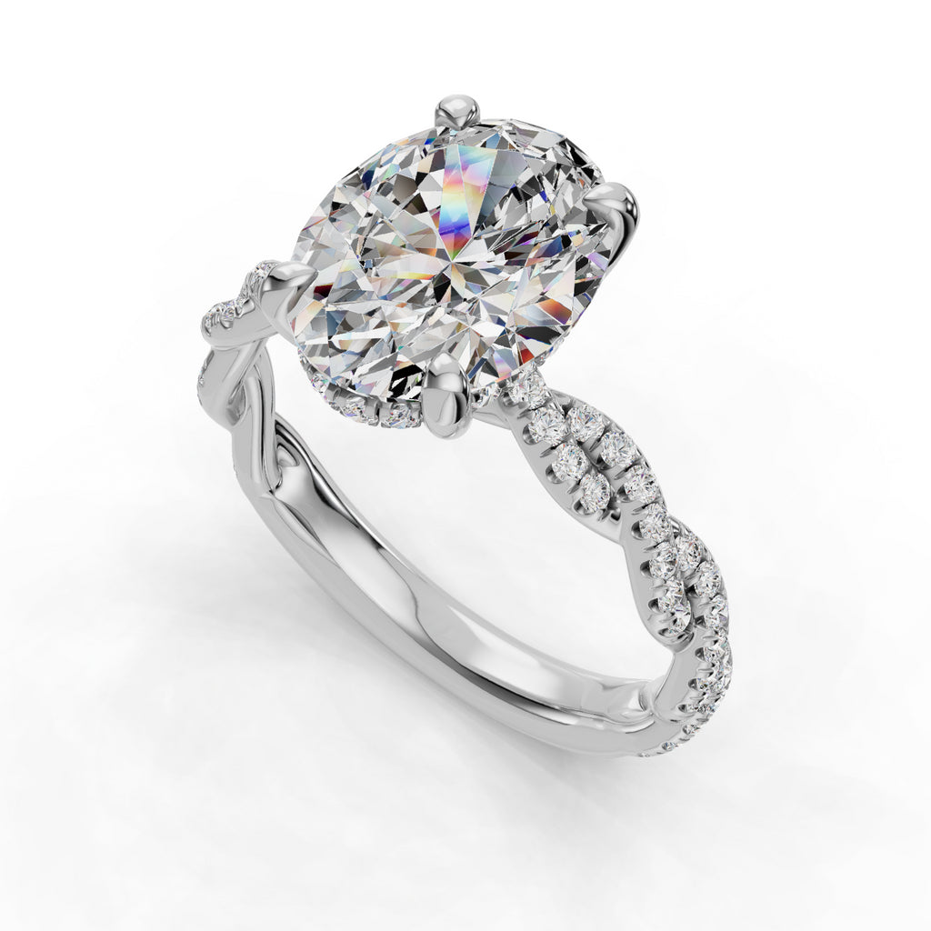 Oval diamond ring with twisted diamond band.