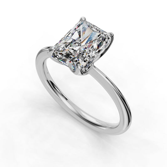 Radiant-cut diamond solitaire on sleek band.