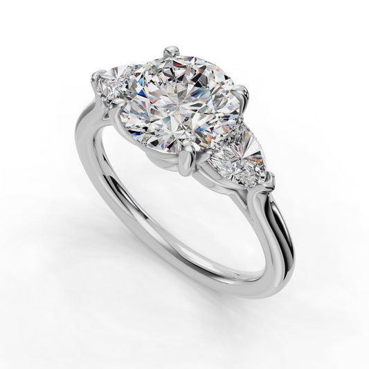 Three-stone diamond ring with round center.