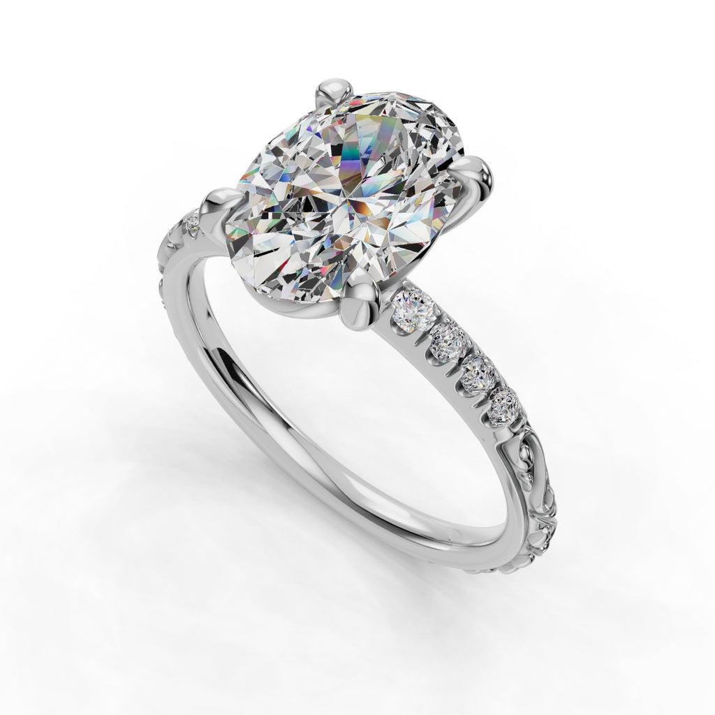 Oval diamond ring with pavé band.