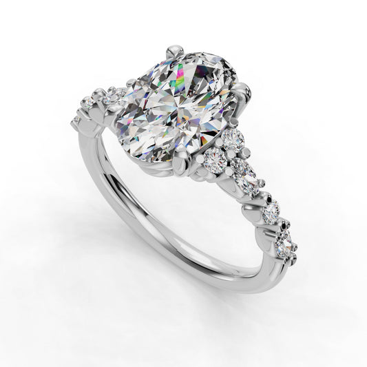 Oval diamond ring with side stones.