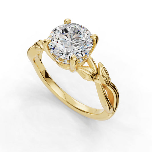 Gold ring with round diamond and leaf design.