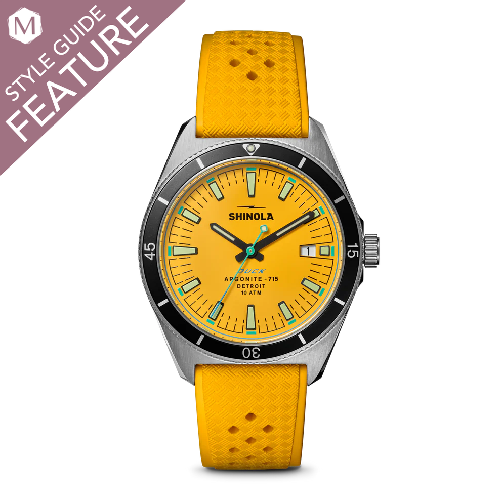 Yellow dial watch with stainless steel case.
