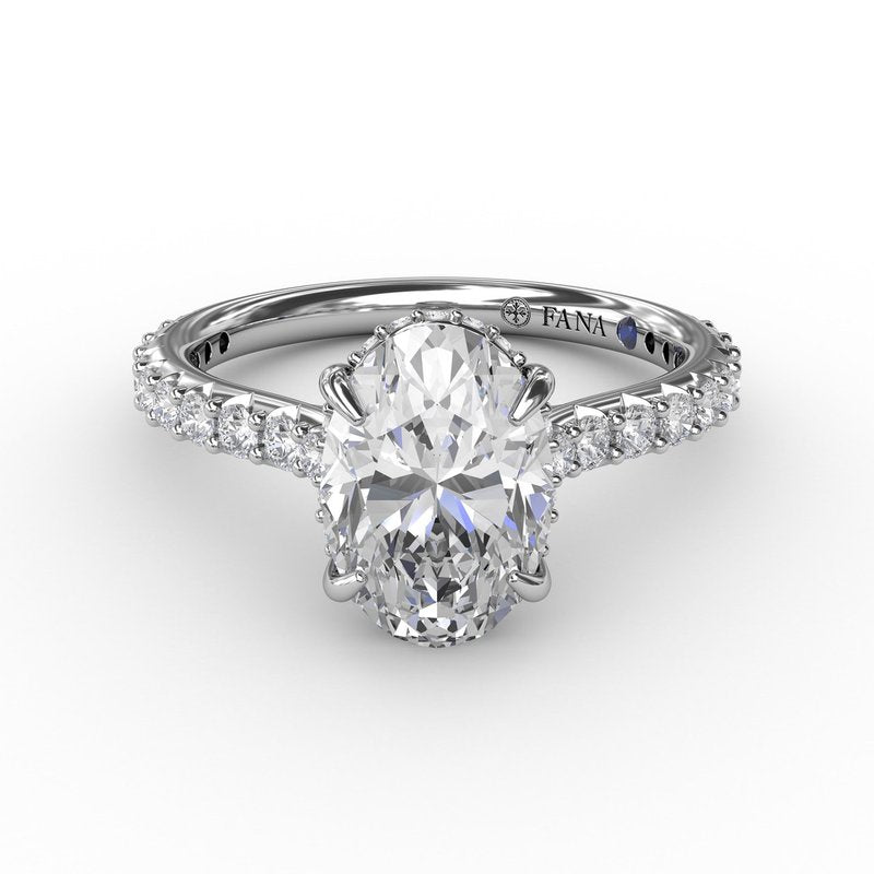Oval diamond ring with accent stones.