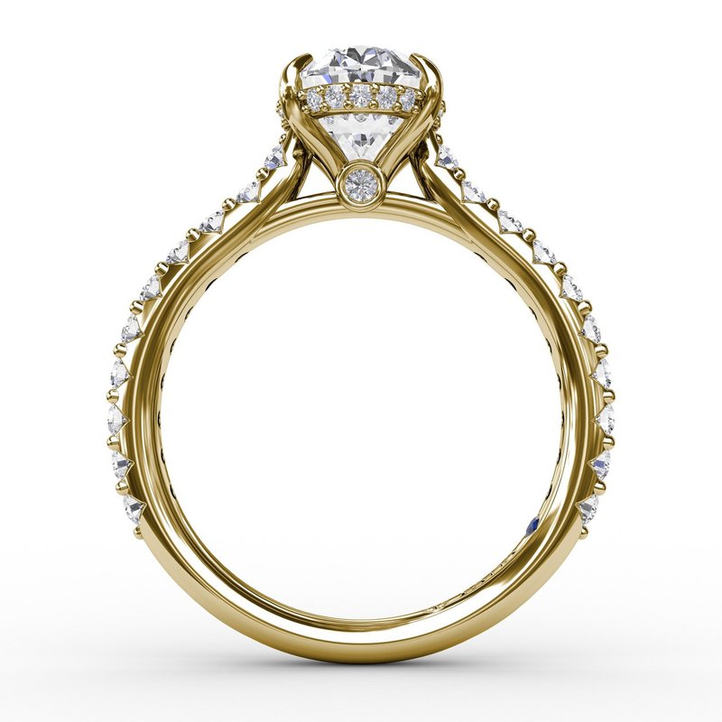 Yellow gold ring with round diamond accents.