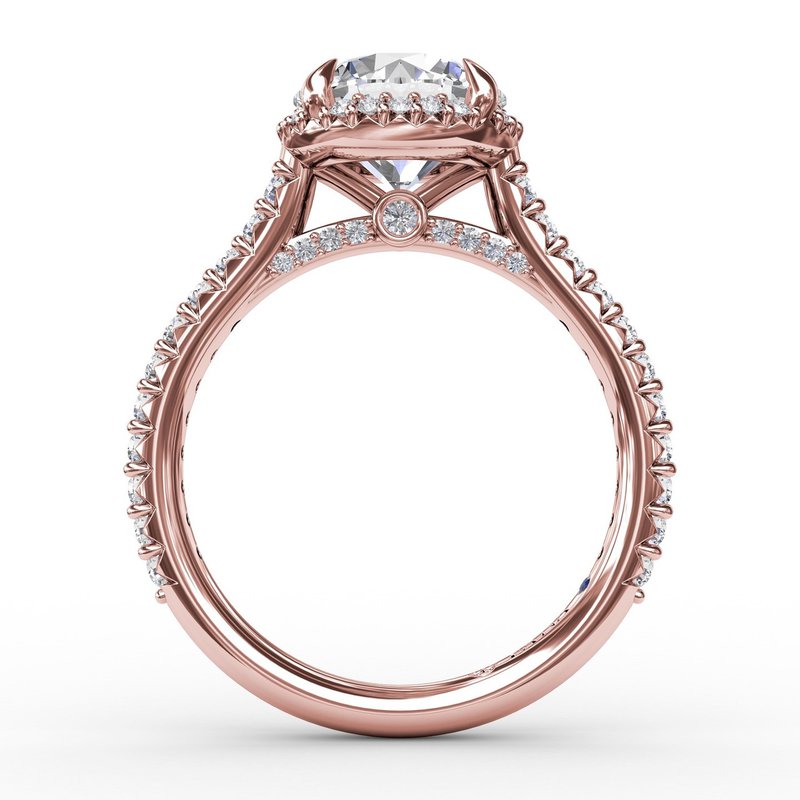 Rose gold diamond halo engagement ring.