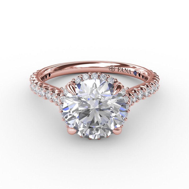 Rose gold halo diamond engagement ring.