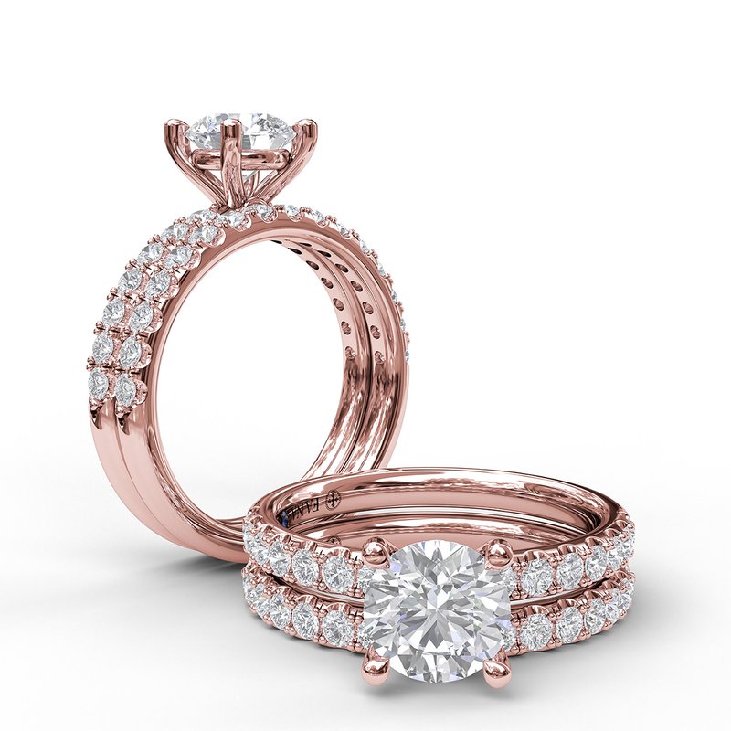 Rose gold diamond engagement ring with sapphire.