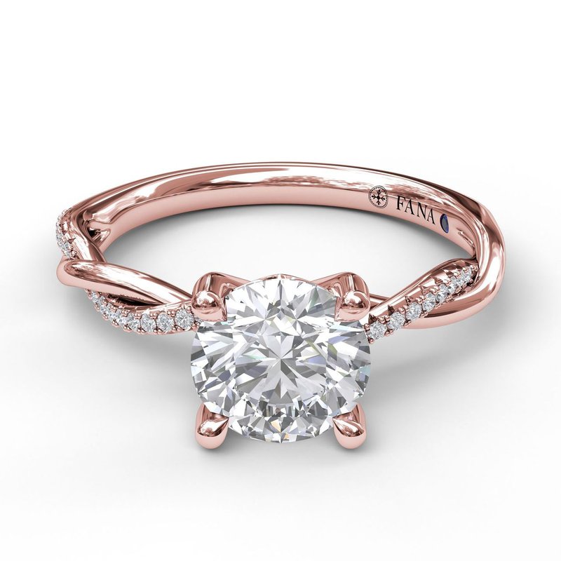 Rose gold ring with round diamond centerpiece.