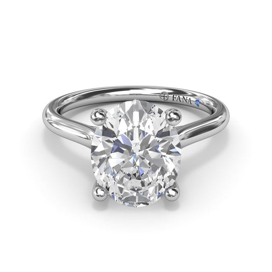 Solitaire diamond ring with hidden sapphire accent.