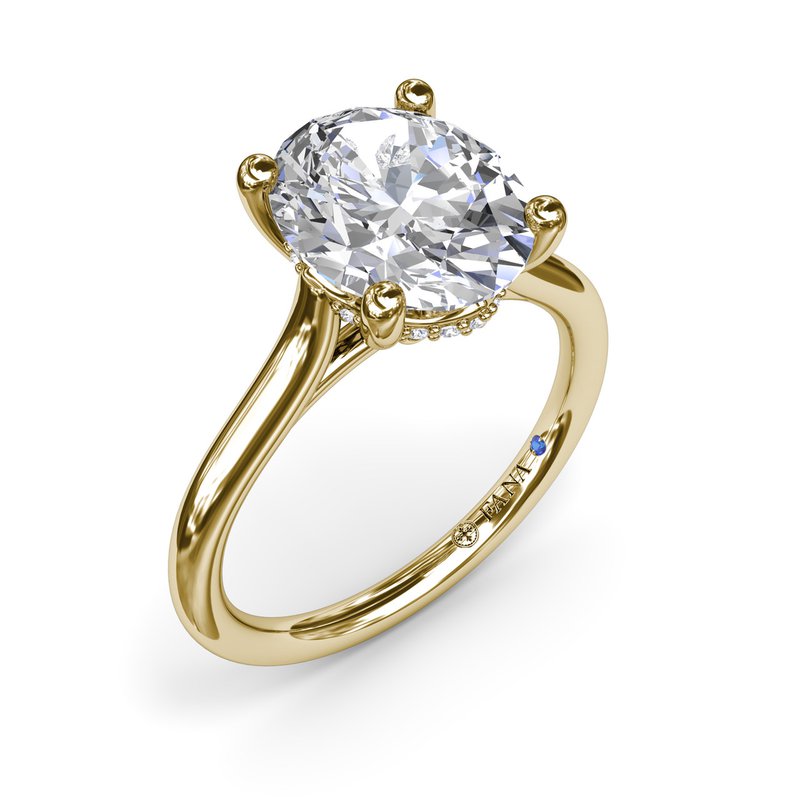 Yellow gold ring with round diamond centerpiece.