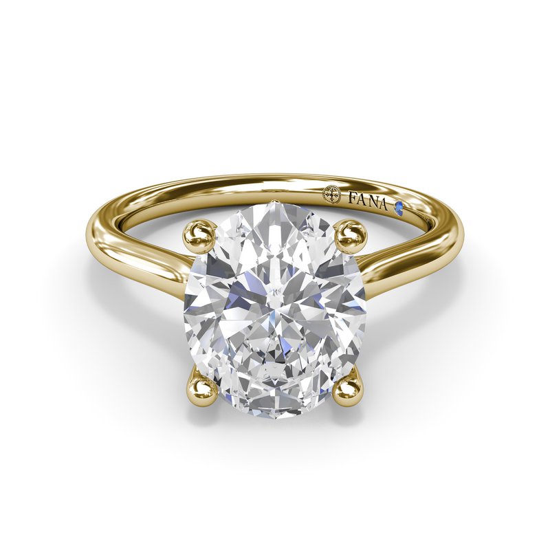Yellow gold solitaire ring with round diamond.