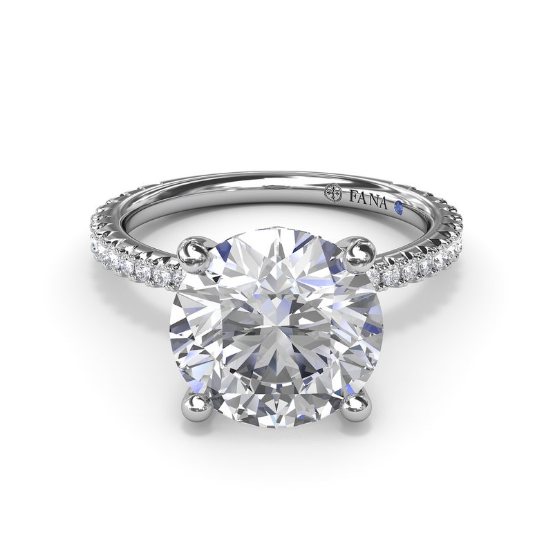 White gold ring with round diamond centerpiece.