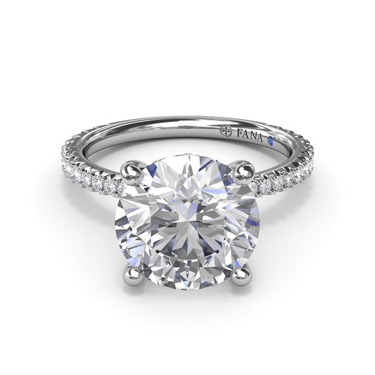 White gold ring with round diamond centerpiece.