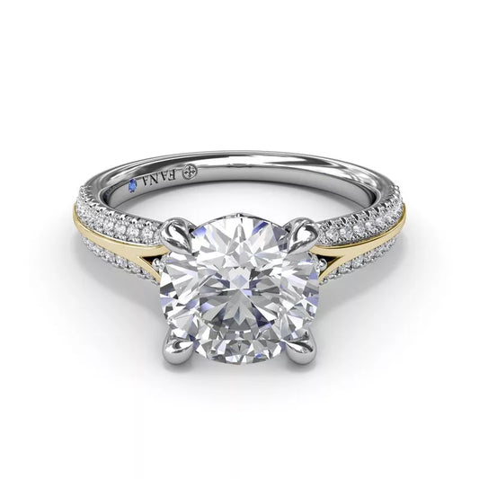 White and yellow gold diamond engagement ring.