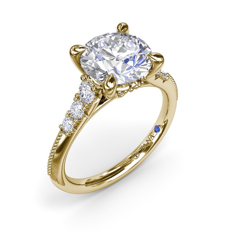 Yellow gold ring with round diamond accents.
