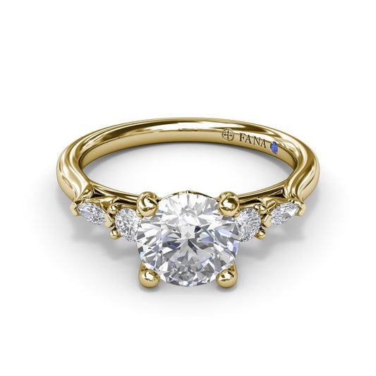 Yellow gold diamond semi-mount engagement ring.